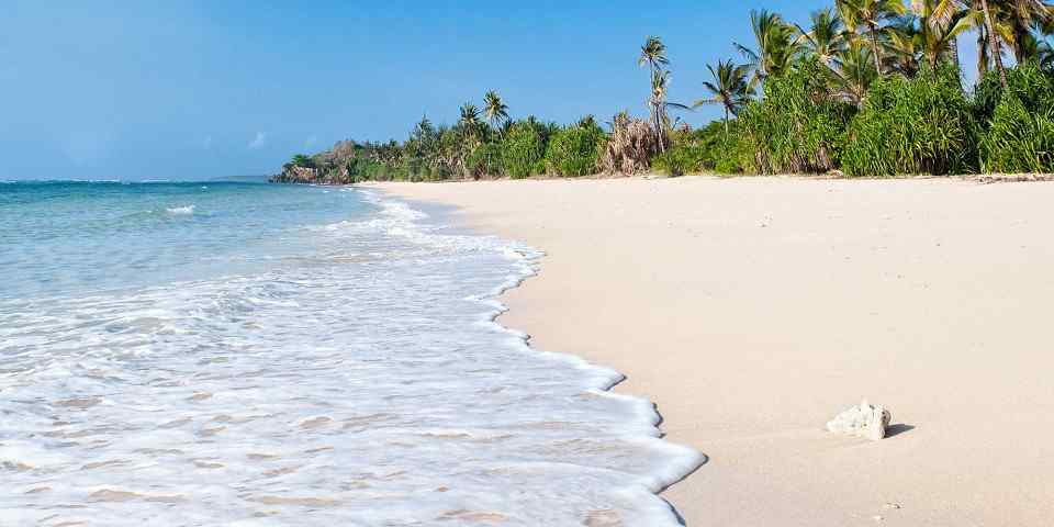 White sandy beach and turquoise Indian Ocean from the client-supplied Diani Beach photo