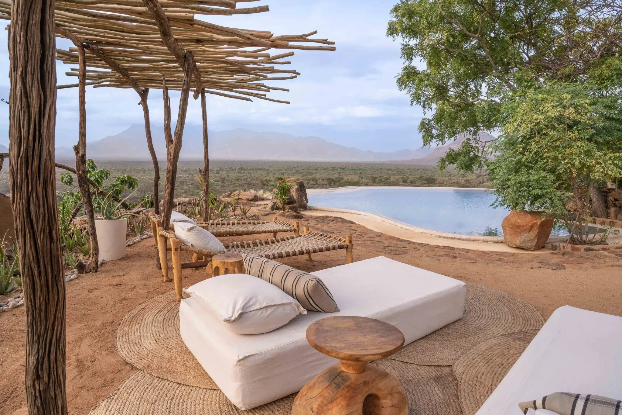 Outdoor pool and relaxed seating framed by the northern Kenya landscape